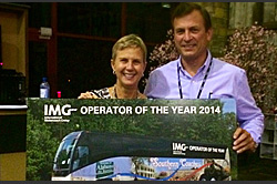 IMG President Bronwyn Wilson presenting John Adams, President of Southern Coaches, with the 2014 IMG Operator of the Year Award.