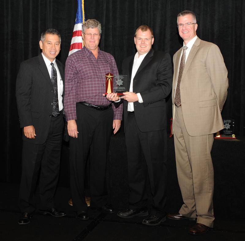 Pictured from left to right - California Highway Patrol, Commissioner Joe Farrow, Michael & Tom Giddens from Pacific Coachways Charter Services and California Highway Patrol, Commercial Vehicle Section commander, Captain Steve Dowling.