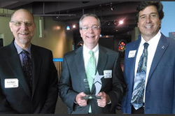 Accepting the award from left to right, “Barry Shapiro – Regional Director; Craig Treanor – Director of Sales; Stephen Story – President”. Accepting the award from left to right, “Barry Shapiro – Regional Director; Craig Treanor – Director of Sales; Stephen Story – President”.