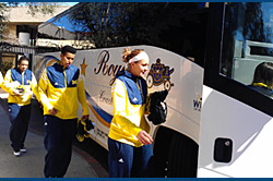 Michigan players board their motor coach. Michigan players board their motor coach.